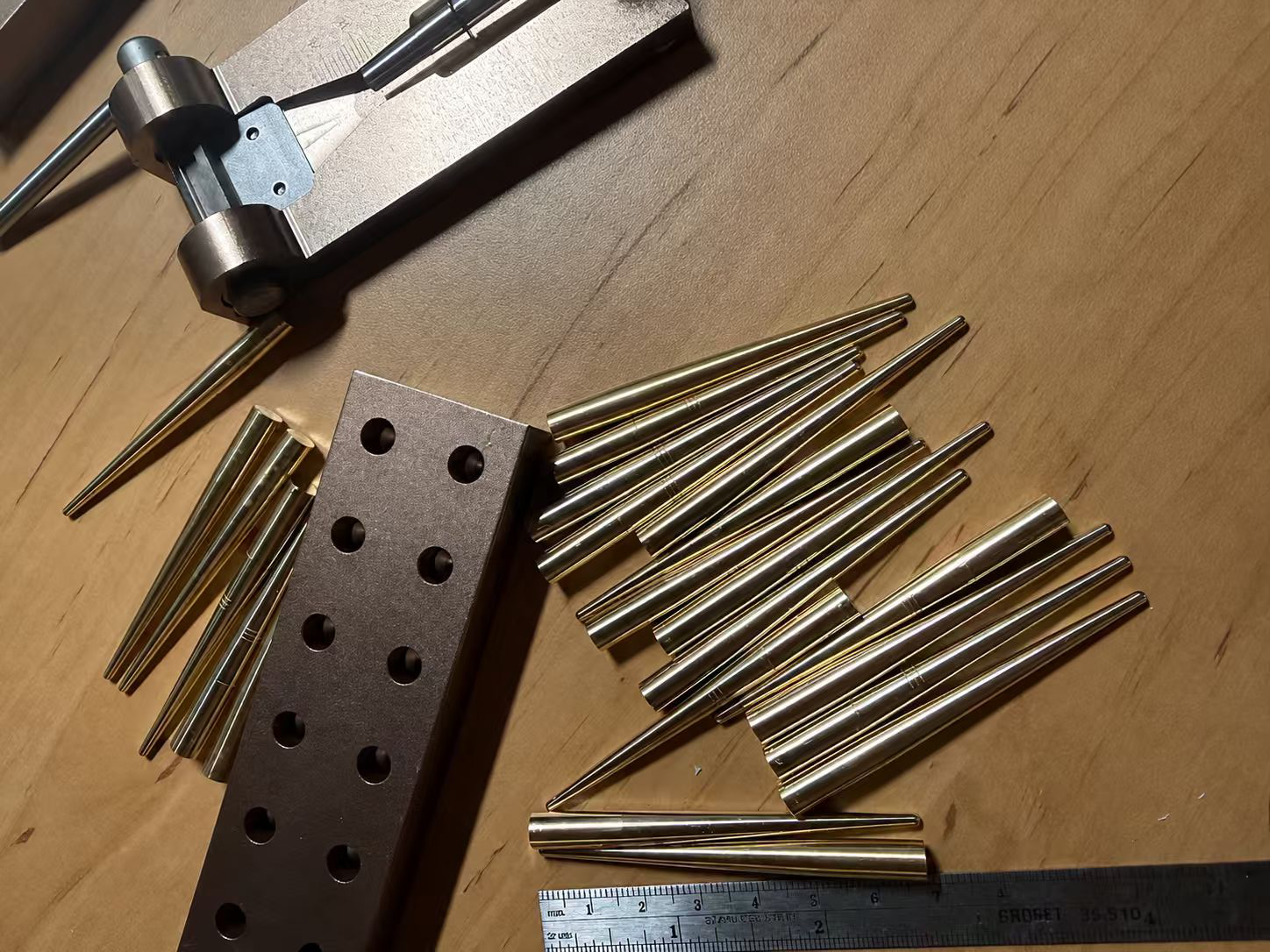HY Music reed-making tools arranged on a workbench.